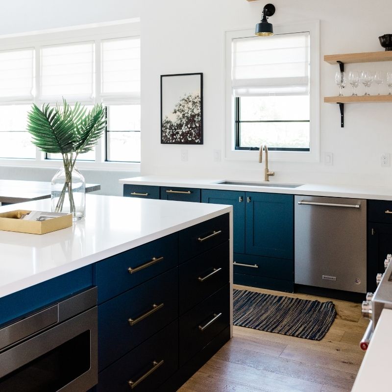 Modern renovated kitchen with navy cabinets